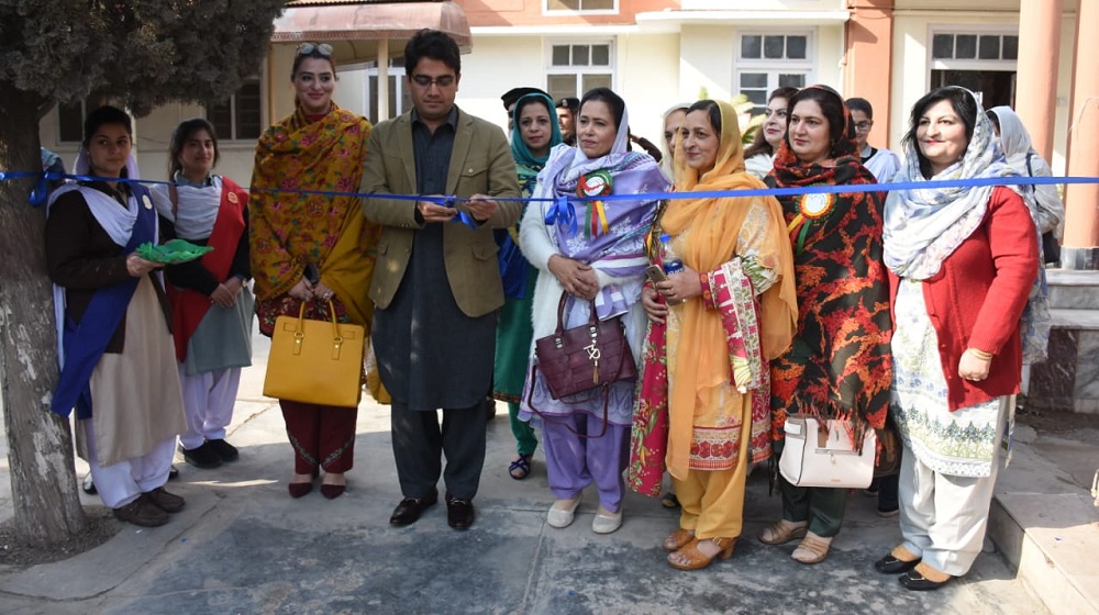 Kamran Khan Bangash  special assistant to chief minster on I.T is cutting a blue ribbon to inaugurate Mega Science exhibition at College of Home Economics. Around 13 female degree colleges participated in the event showcasing 130 science models.